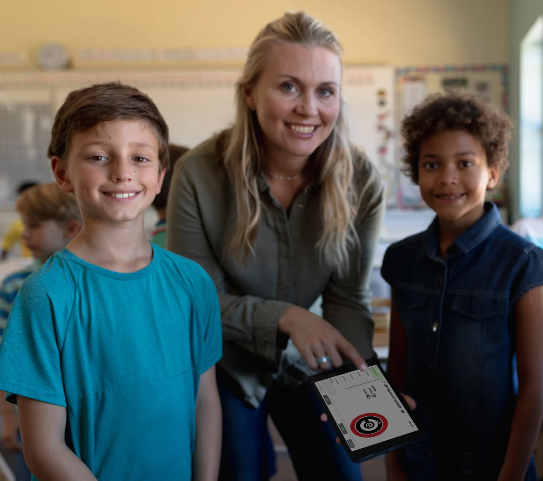 Teacher and students using a tablet during a robotics learning activity